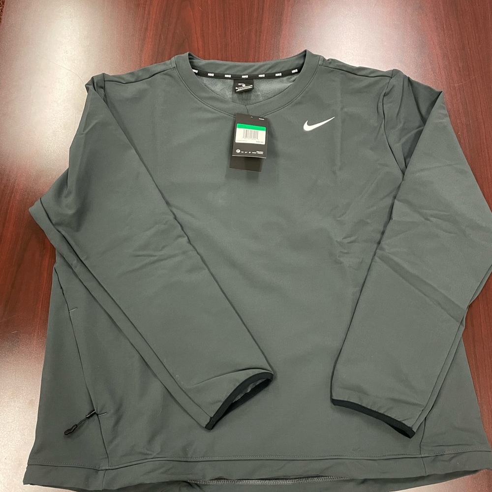 Gray Nike pull over with zippered pockets